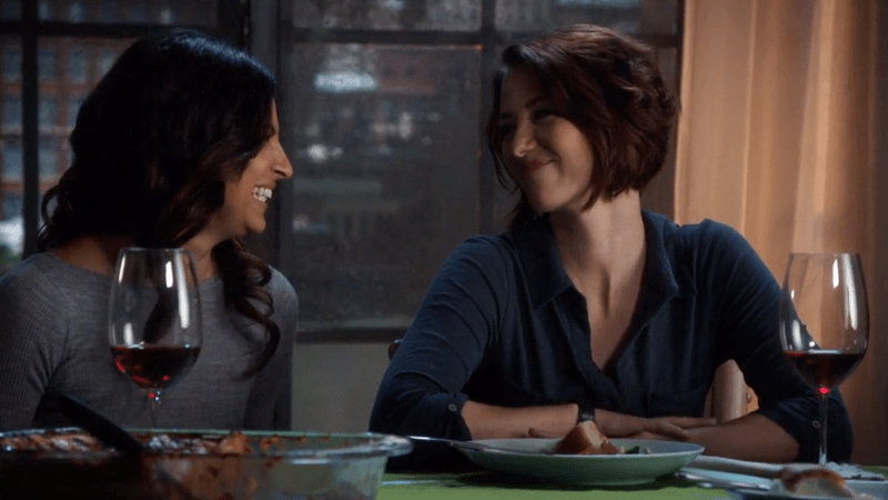 Maggie and Alex laugh with each other