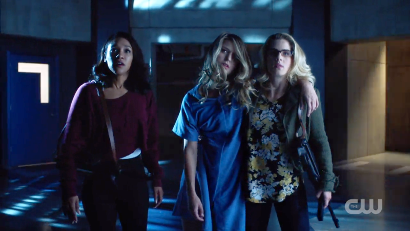 iris and Felicity help Kara to the elevator