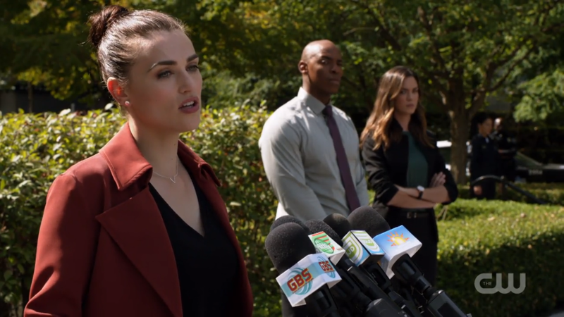 Lena gives a speech at a podium