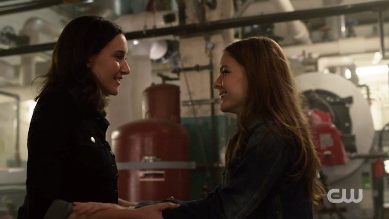 Kara and Alex smile at each other