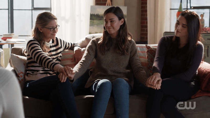 Sam puts her hand on Kara and Lena's knees