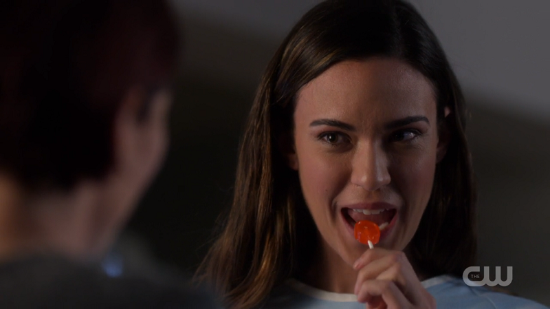 Sam eats her lollipop
