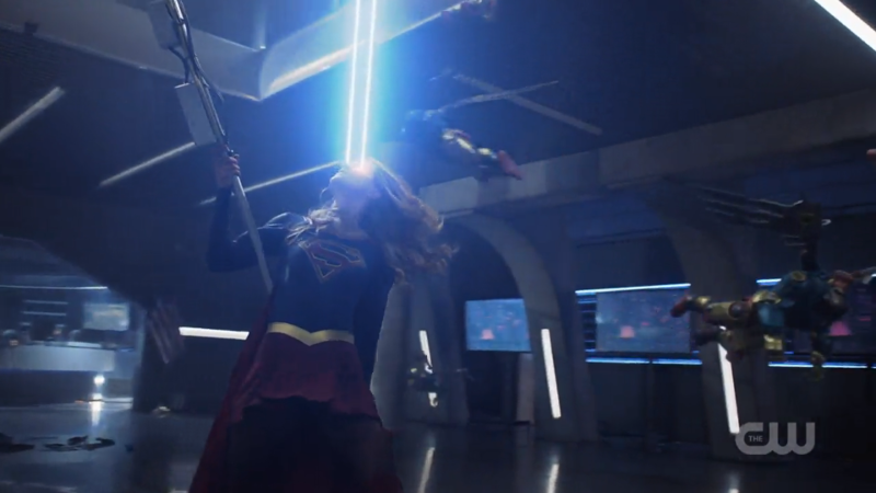 Supergirl uses her heat vision and also the post as a fighting stick