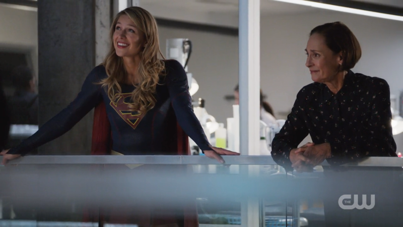 Supergirl and Winn's mom have a chat on the balcony