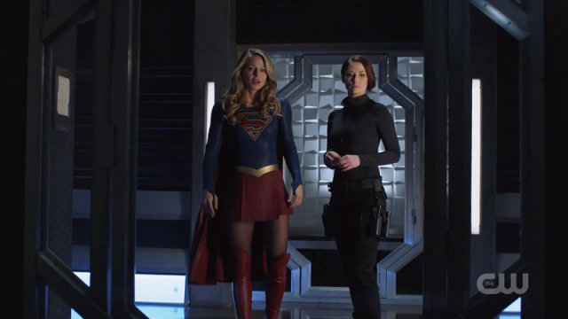 Supergirl and Agent Danvers stand side by side
