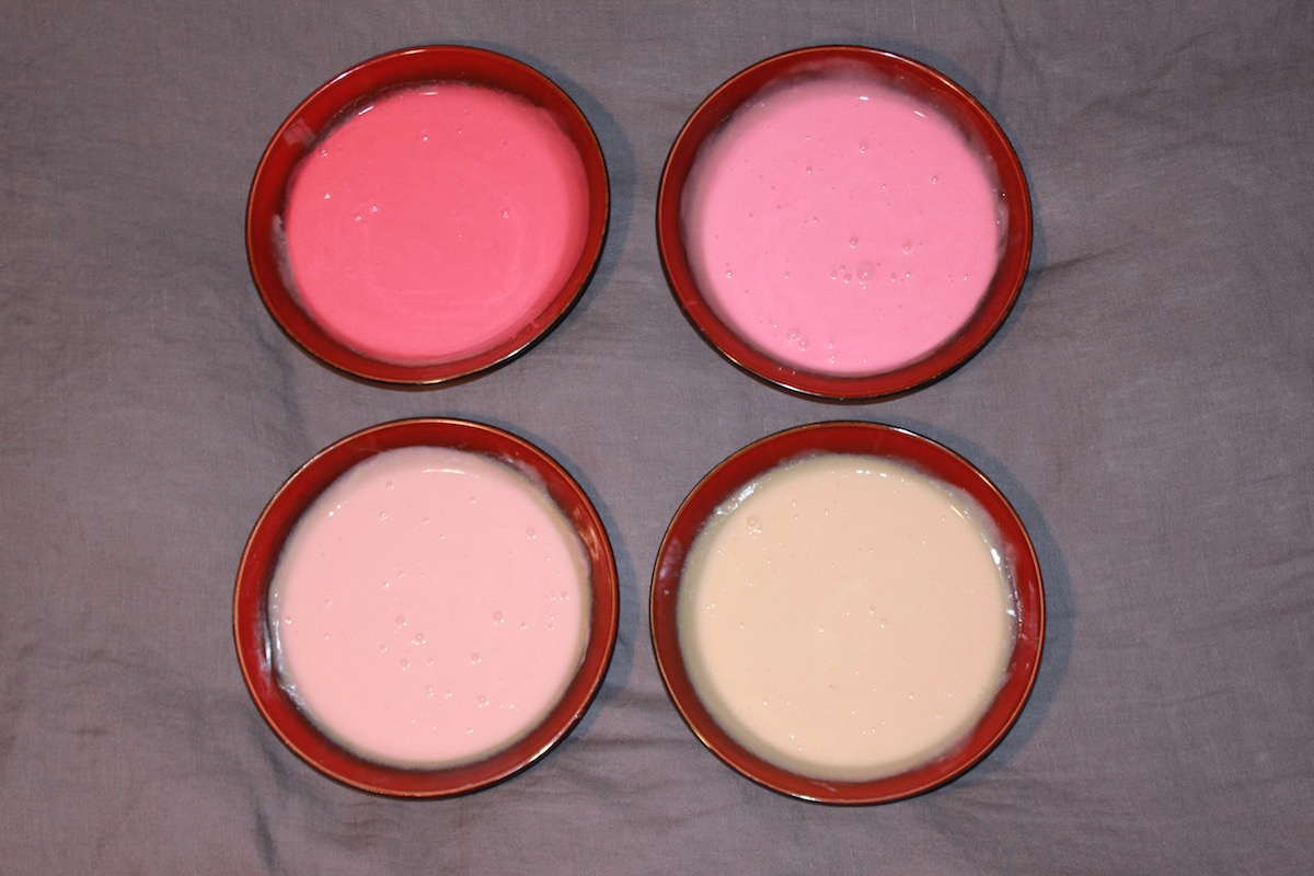 four cakes, various shades of pink