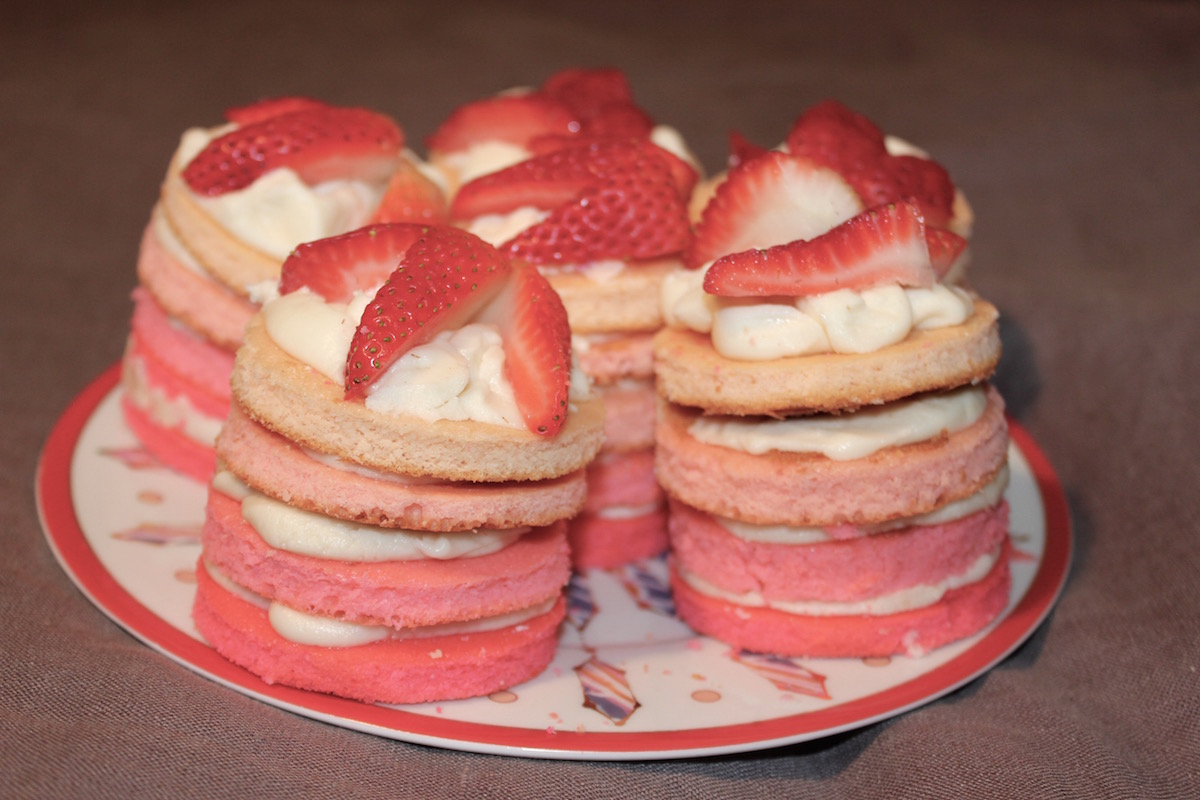 mini ombre cakes with strawberries on top