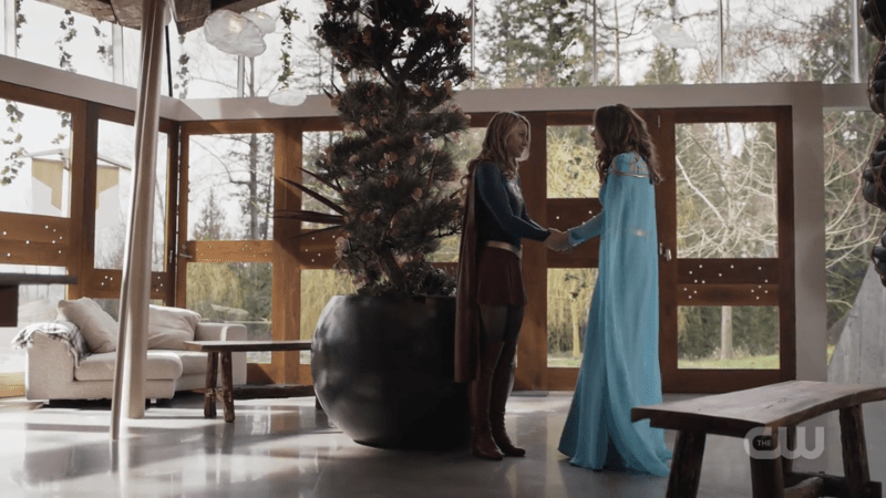 Kara and her mom hold hands in a spacious home