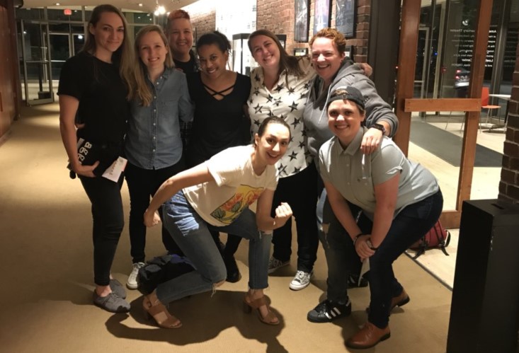 Lauren Patten poses with a bunch of over-excited queerdos