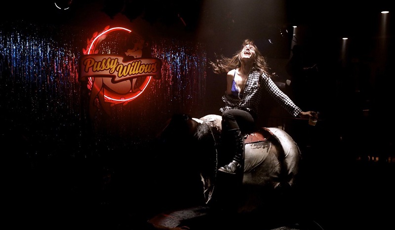 Wynonna Earp on a mechanical bull