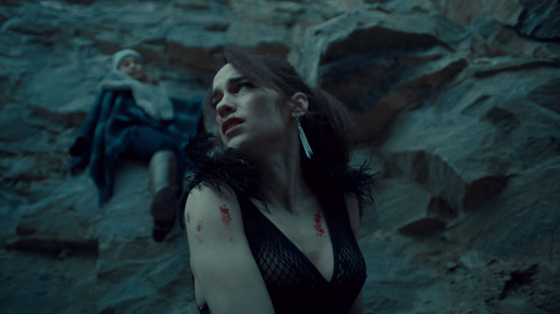 Wynonna sits on the cliff with her mama behind her