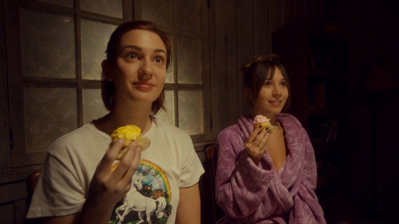 Waverly and Nicole look glamoured while they hold their cupcakes