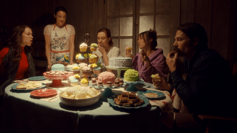 Jolene looks over Wynonna, Nicole, Waverly and Doc as they dig in