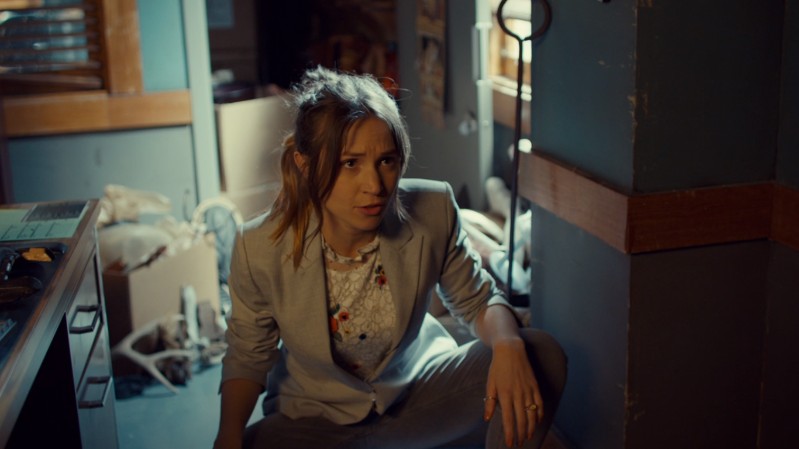 Waverly squats in her blazer like a gay