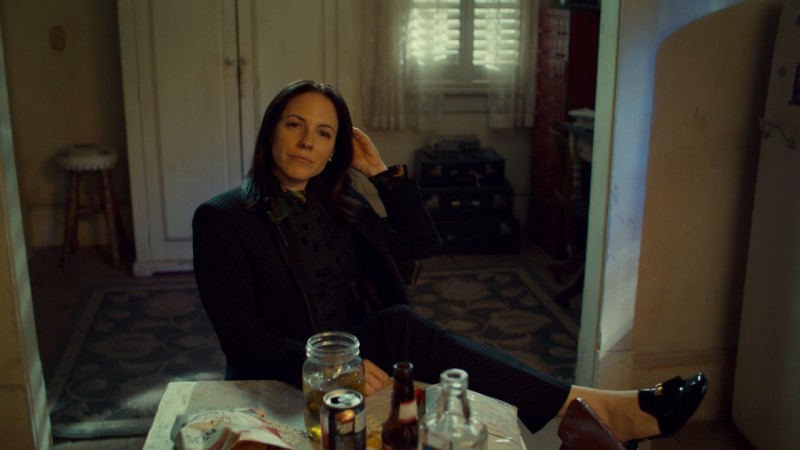 Anna Silk looks fly af while leaning back in a chair with a Kevinly smirk