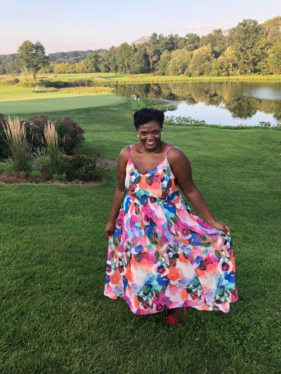 reneice charles in a floral sundress
