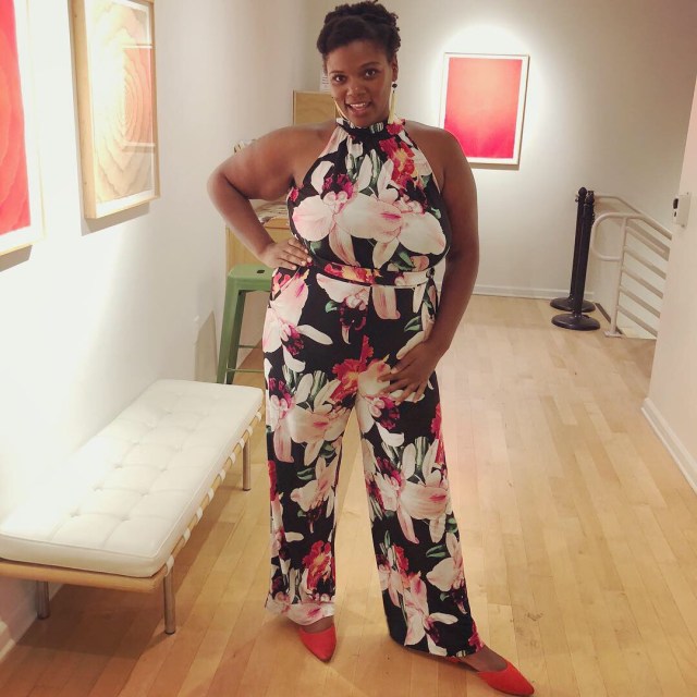 reneice charles in a floral pantsuit