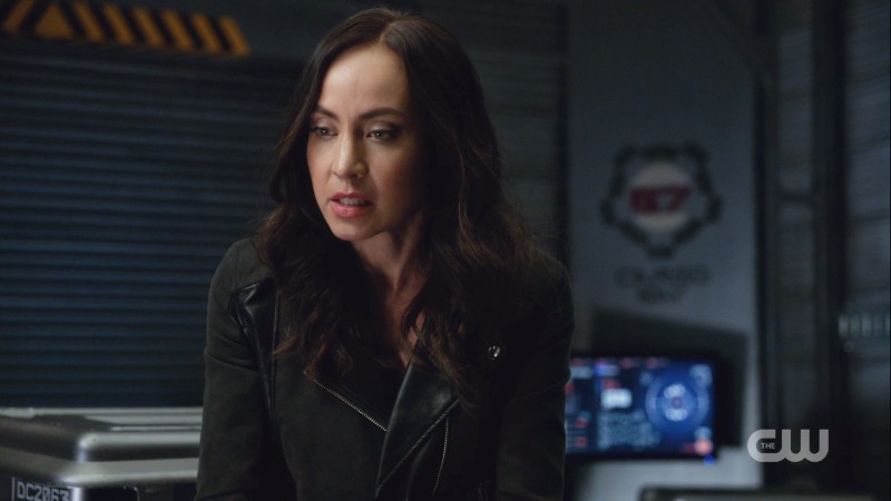 Nora is wearing a leather jacket in the dark