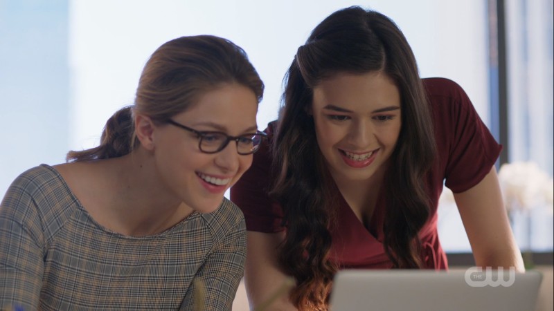 Kara and Nia look happily at the computer