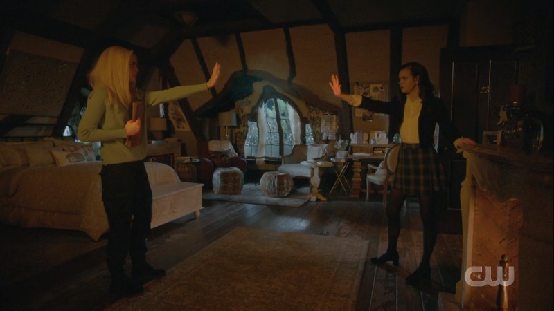 Josie and Lizzie throw spells at each other