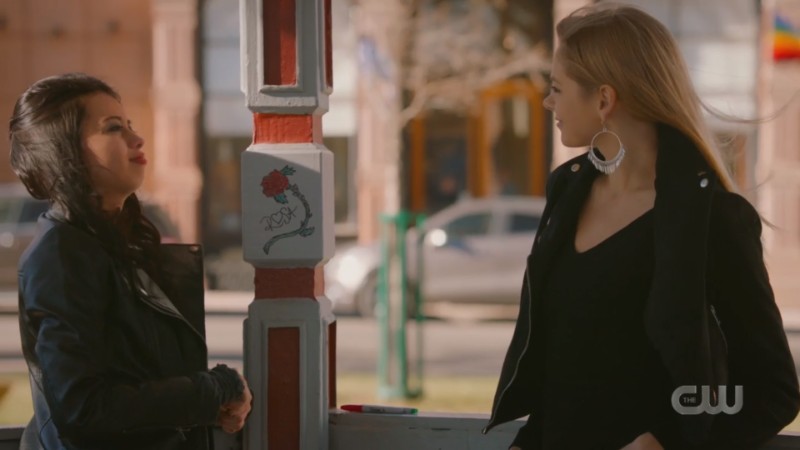 Rosa and Isobel chat while doing graffiti in a flashback