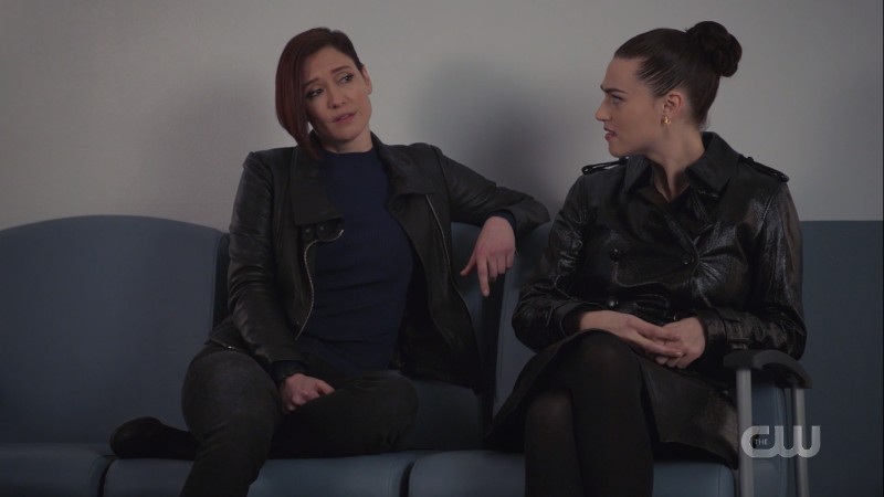 Alex leans gaily while Lena sits attentively 