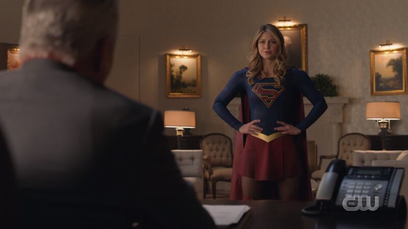 supergirl hands on hips