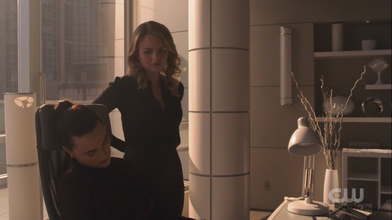 Eve looks down at Lena as if maybe she's having second thoughts