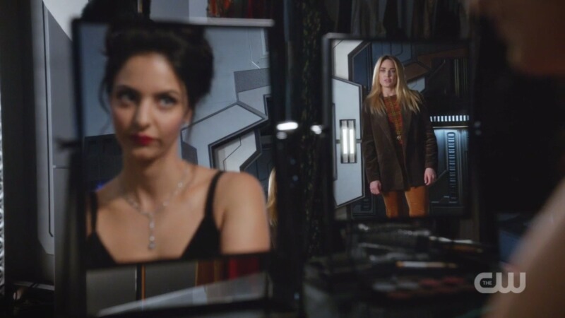 Sara and Zari look at each other through mirrors 