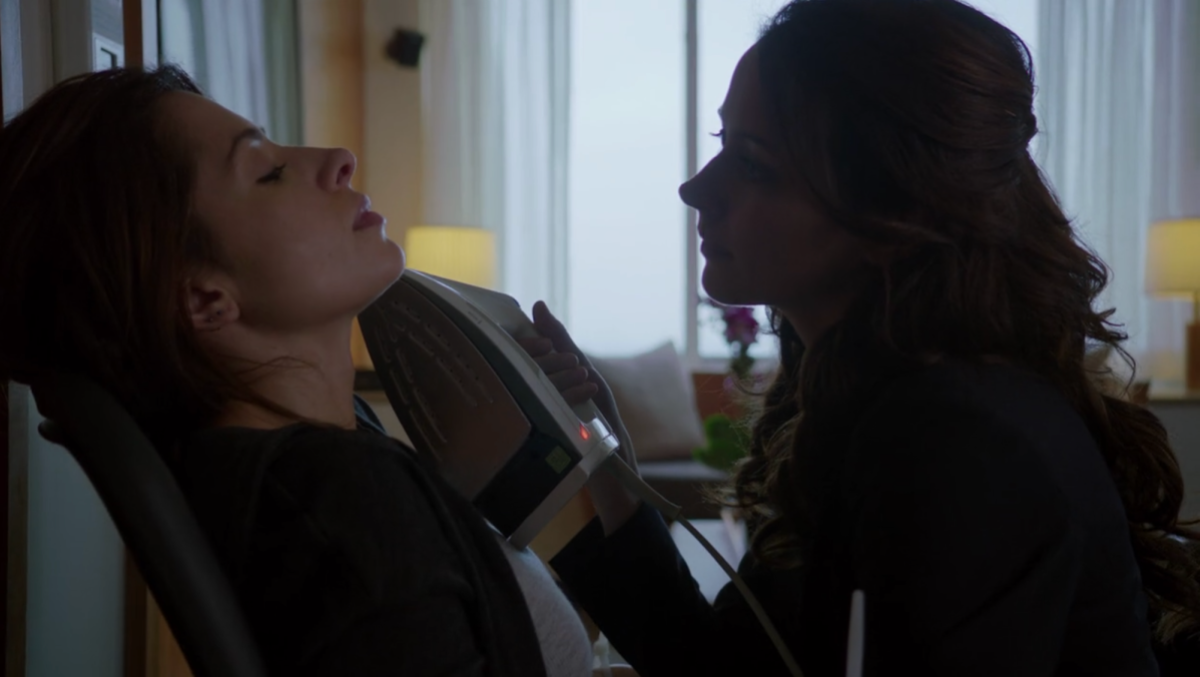 Root holds an iron close to Shaw's face on Person Of Interest