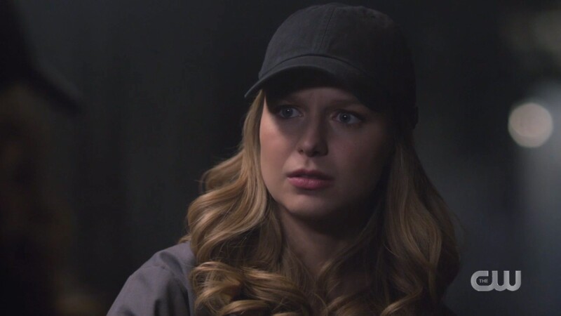 Kasnian Kara has a black baseball cap on and looks weirded out by Eve