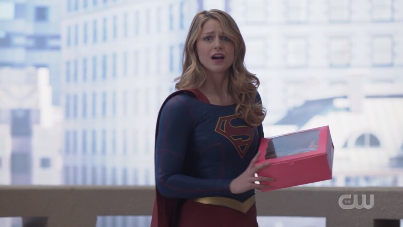 Supergirl comes bearing a pink box of donuts