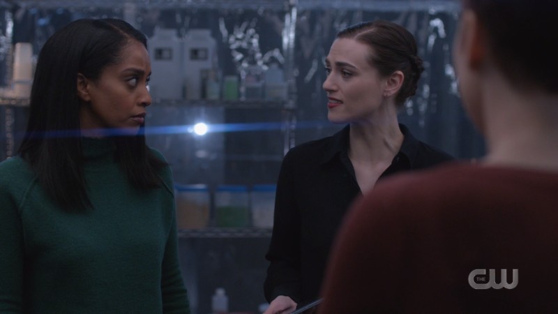 Lena looks distraught in her lab; Kelly is next to her 