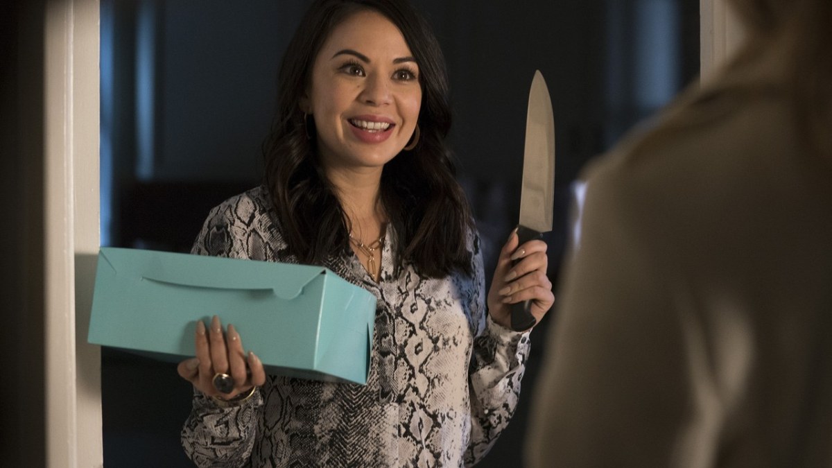 Mona holds a box in one hand and knife in the other hand on Pretty Little Liars: The Perfectionists