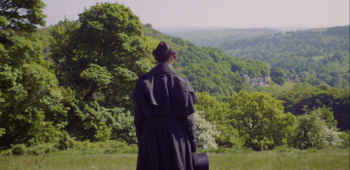 Anne Lister, back to us, looking over Shibden Hall