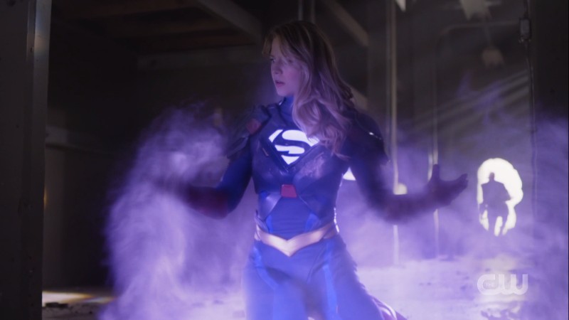 Supergirl absorbs the purple energy of Red Daughter