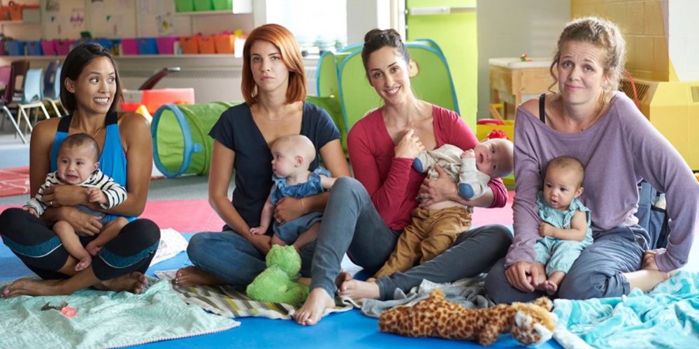 four main characters of Workin Moms holding their babies