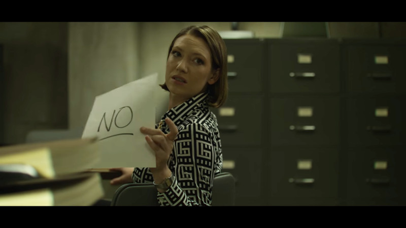 wendy holds up a sign that says NO 
