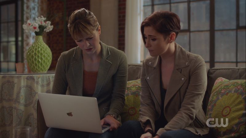 Kara and Alex look at a laptop together