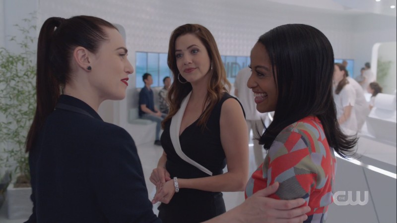 Lena and Kelly beam at each other while Andrea watches