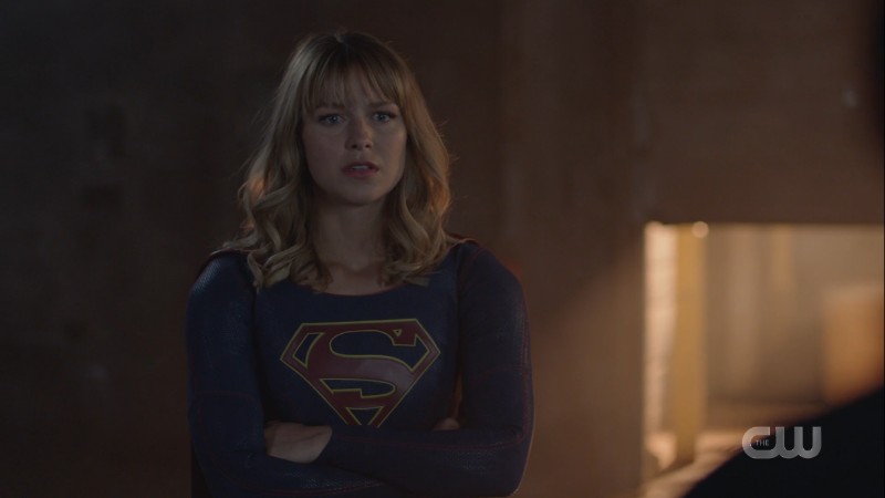 Supergirl crosses her arms