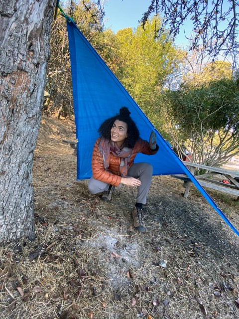 abeni in her makeshift rain shelter