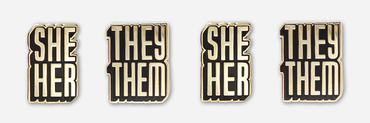 autostraddle merch she/her and they/them pronoun pins