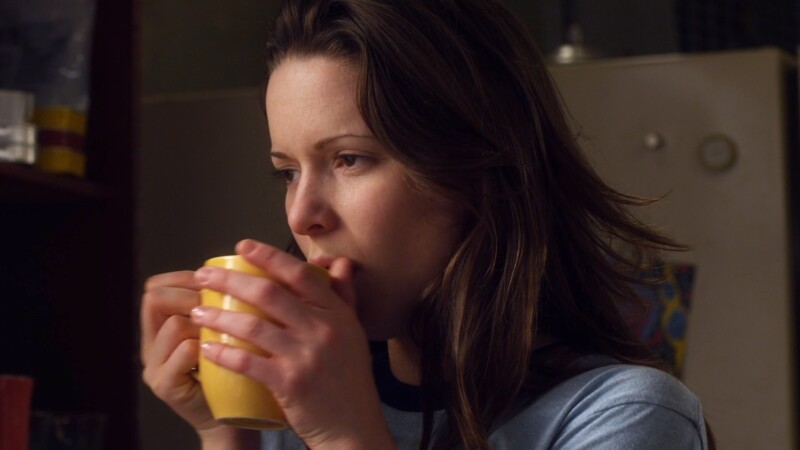 Emily Levison sippin coffee