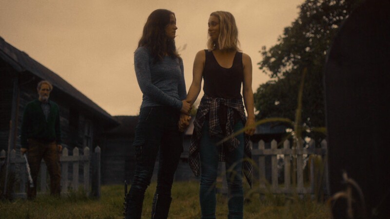 Vanessa holds Susan's hand
