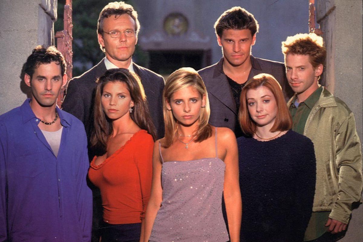Image: a promotional photo of the cast of Buffy the Vampire Slayer: Xander, Cordelia, Giles, Buffy, Angel, Willow, Oz