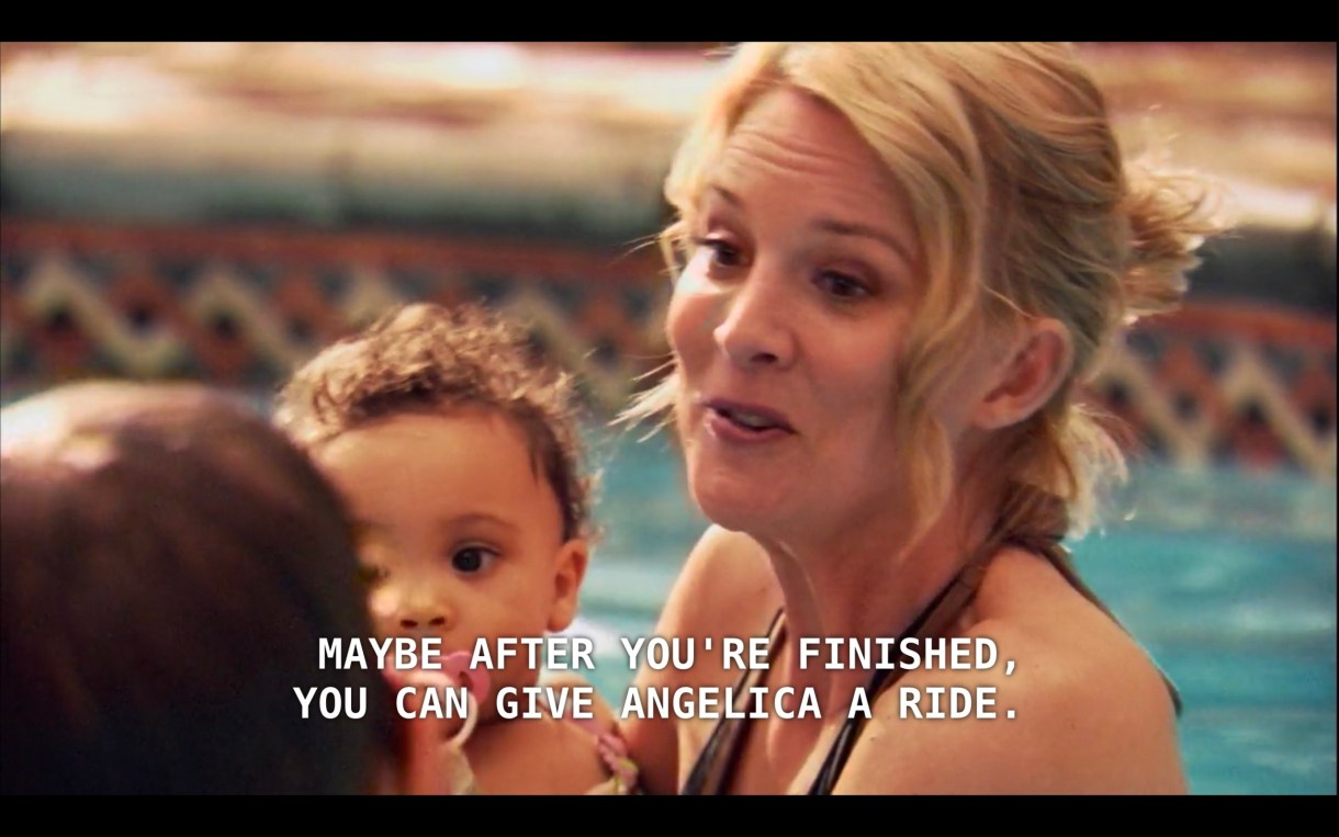 Tina is holding Angelica in the pool. She says to Henry (whose back is to the camera), "Maybe after you've finished, you can give Angelica a ride."