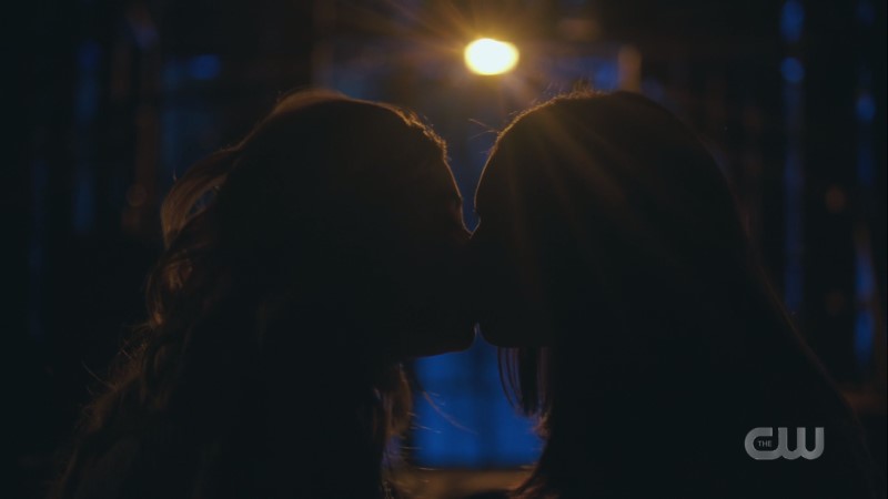 Jade and Josie kiss in the shadows