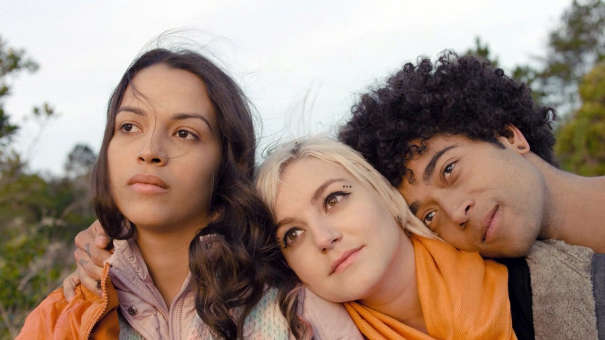 lesbian movies on netflix — three teenagers hold each other while looking towards the sun