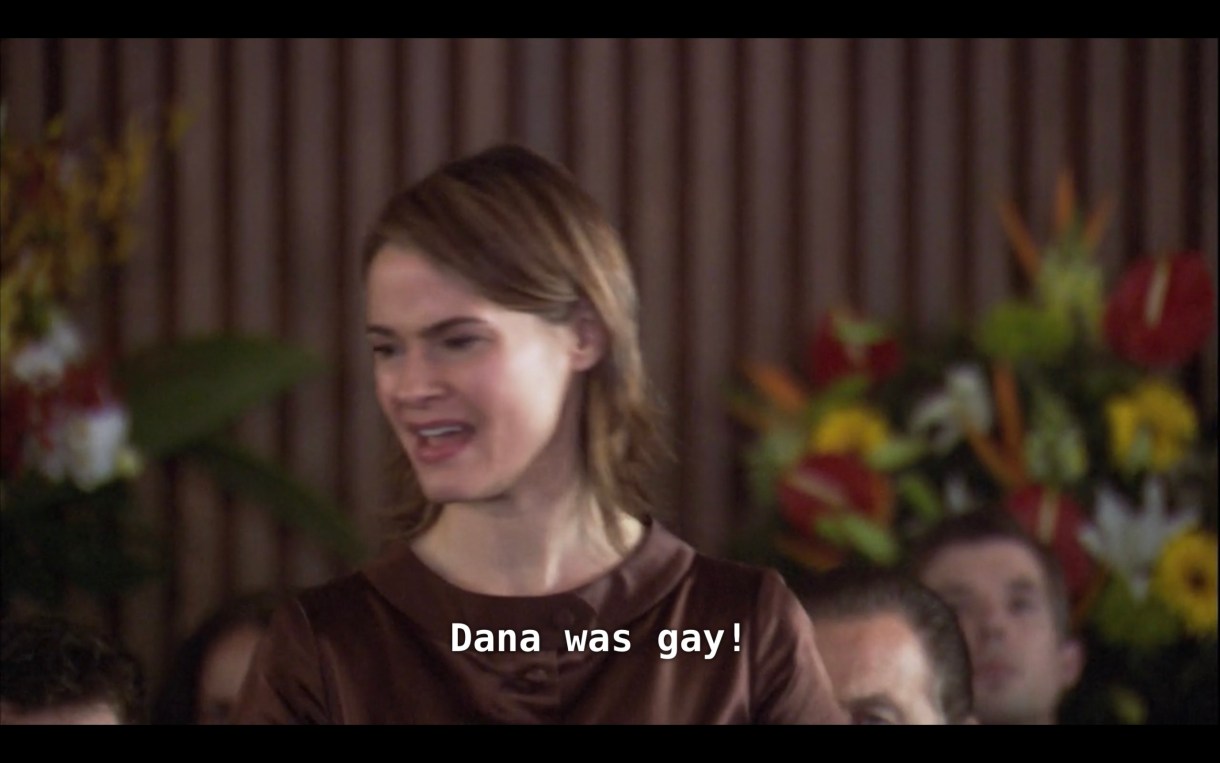 Alice (notably wearing a brown dress at a funeral) stands up in the crowd at Dana's funeral service and yells, "Dana was gay!"